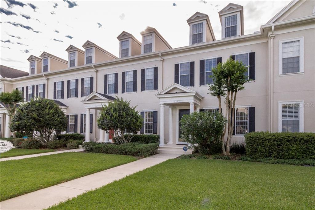 339 Celebration Boulevard Celebration, FL 34747 - Photo 1 of 1 a front view of a house with a yard