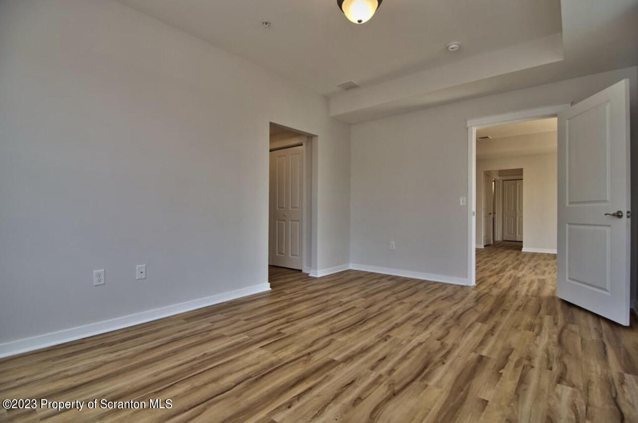 135 Bianca Way Old Forge, PA 18518 - Photo 7 of 11 a view of an empty room with wooden floor