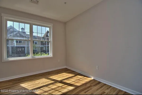 a view of empty room with windows
