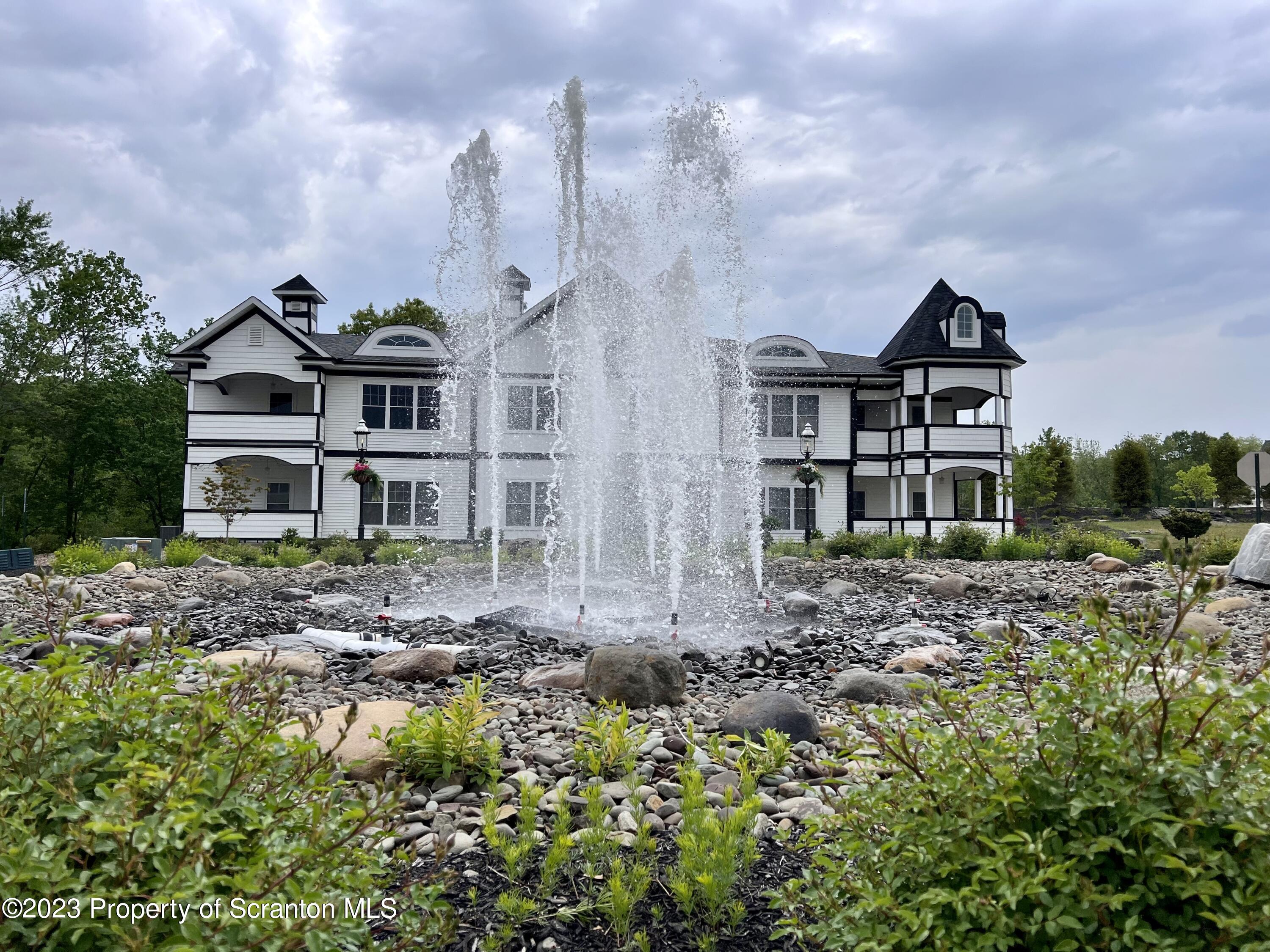 135 Bianca Way Old Forge, PA 18518 - Photo 10 of 11 a front view of a house with a yard