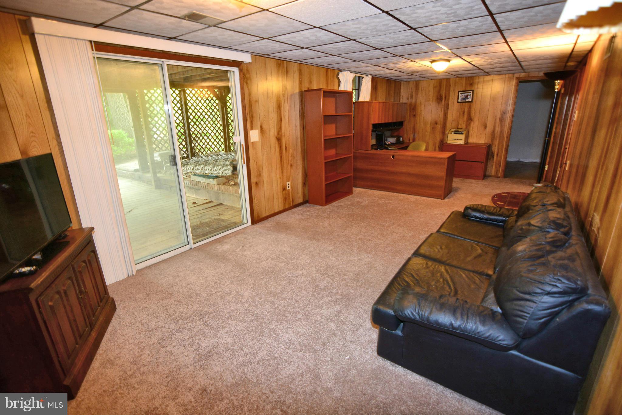 1563 Long Point Road Pasadena, MD 21122 - Photo 17 of 26 Lower level rec room with walkout to deck