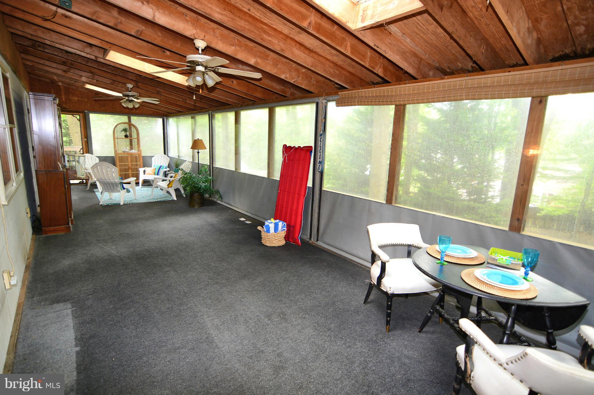1563 Long Point Road Pasadena, MD 21122 - Photo 9 of 26 Screened porch runs the length of the house