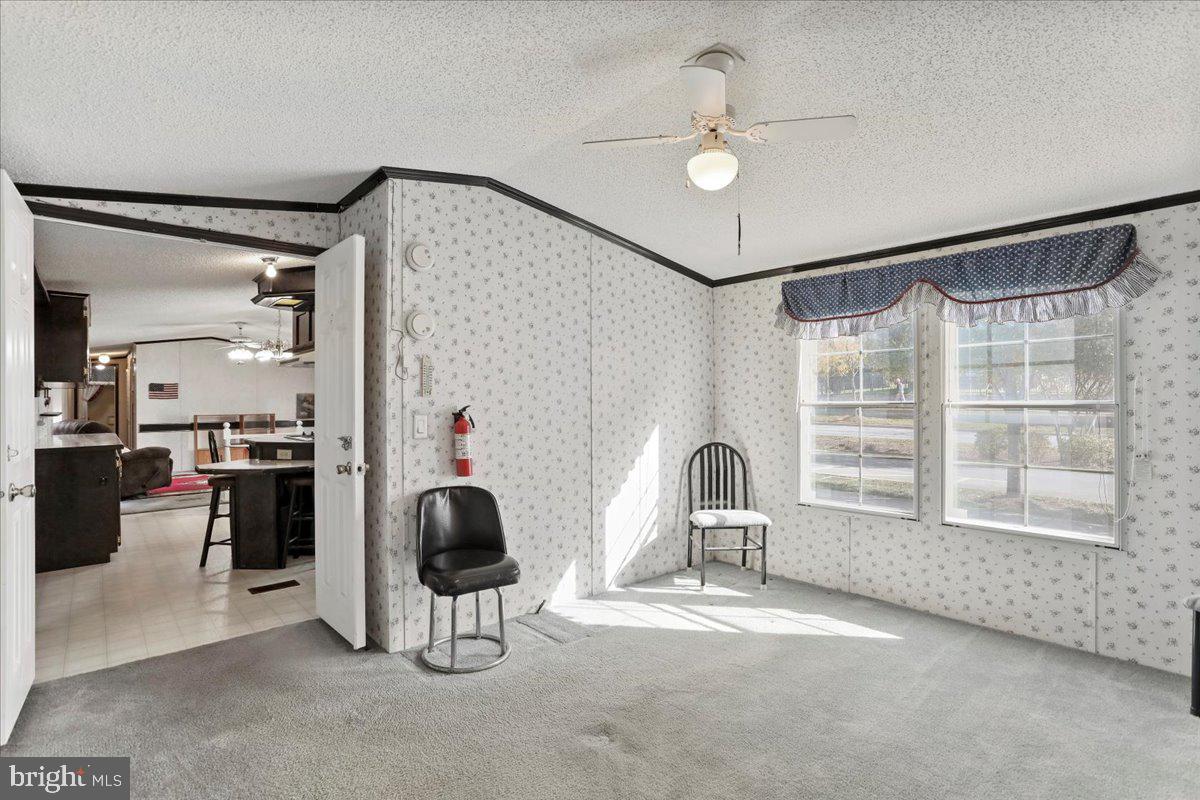 111 North Fairfax Boulevard Ranson, WV 25438 - Photo 19 of 32 a living room with furniture and a window