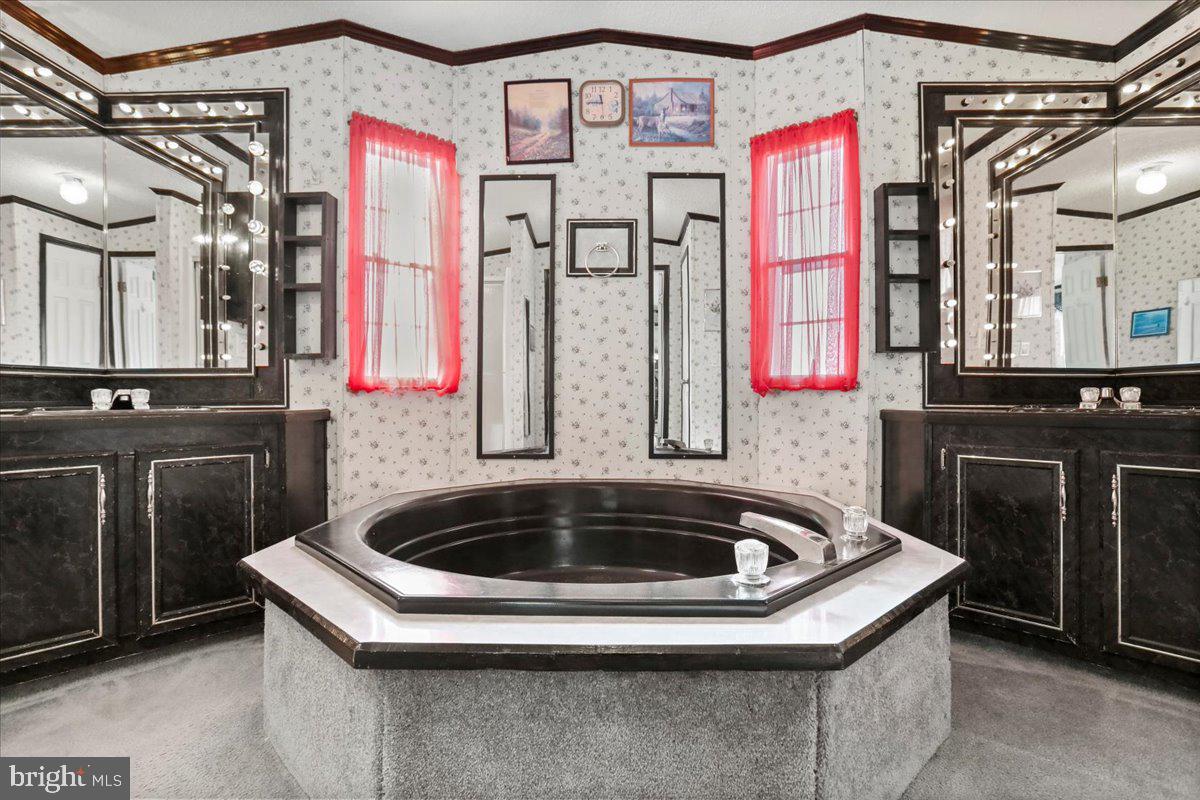 111 North Fairfax Boulevard Ranson, WV 25438 - Photo 20 of 32 a bathroom with a sink and a bathtub