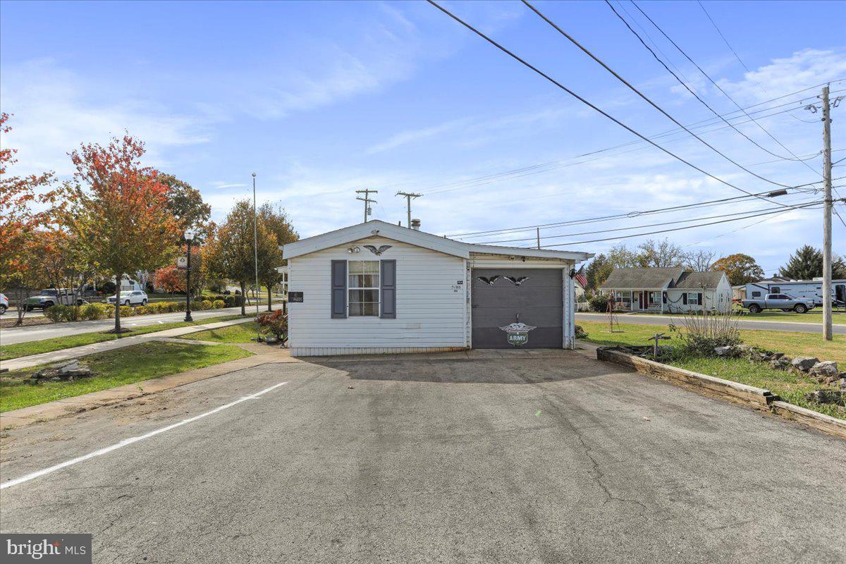 111 North Fairfax Boulevard Ranson, WV 25438 - Photo 28 of 32 a view of a house with a yard and potted plants