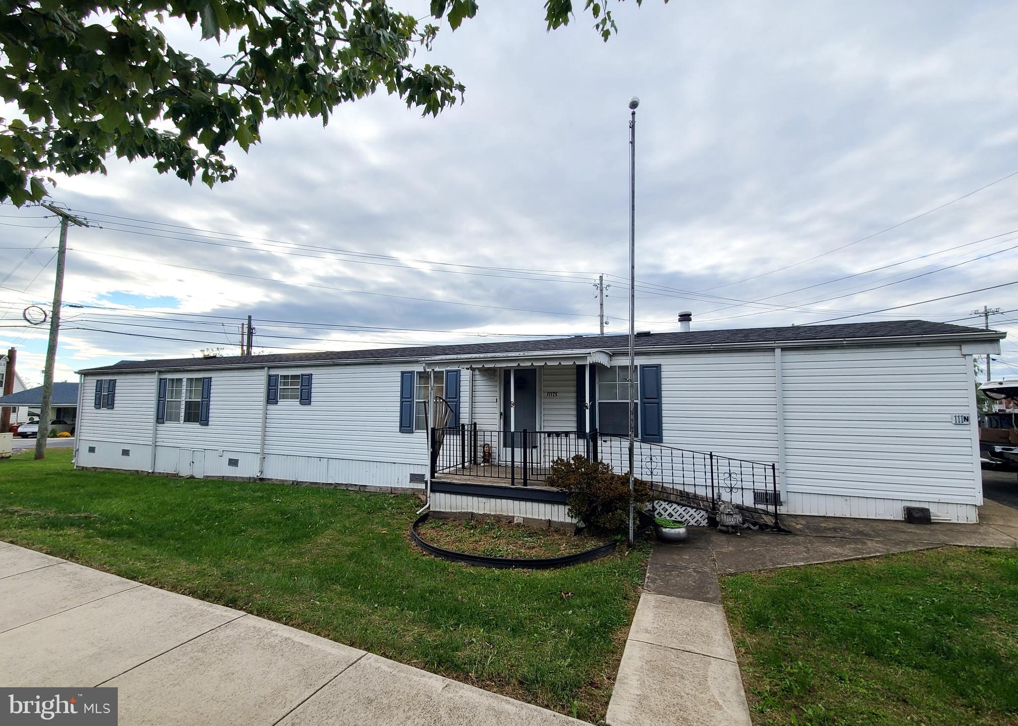 111 North Fairfax Boulevard Ranson, WV 25438 - Photo 3 of 32 a view of a house with backyard sitting area and garden