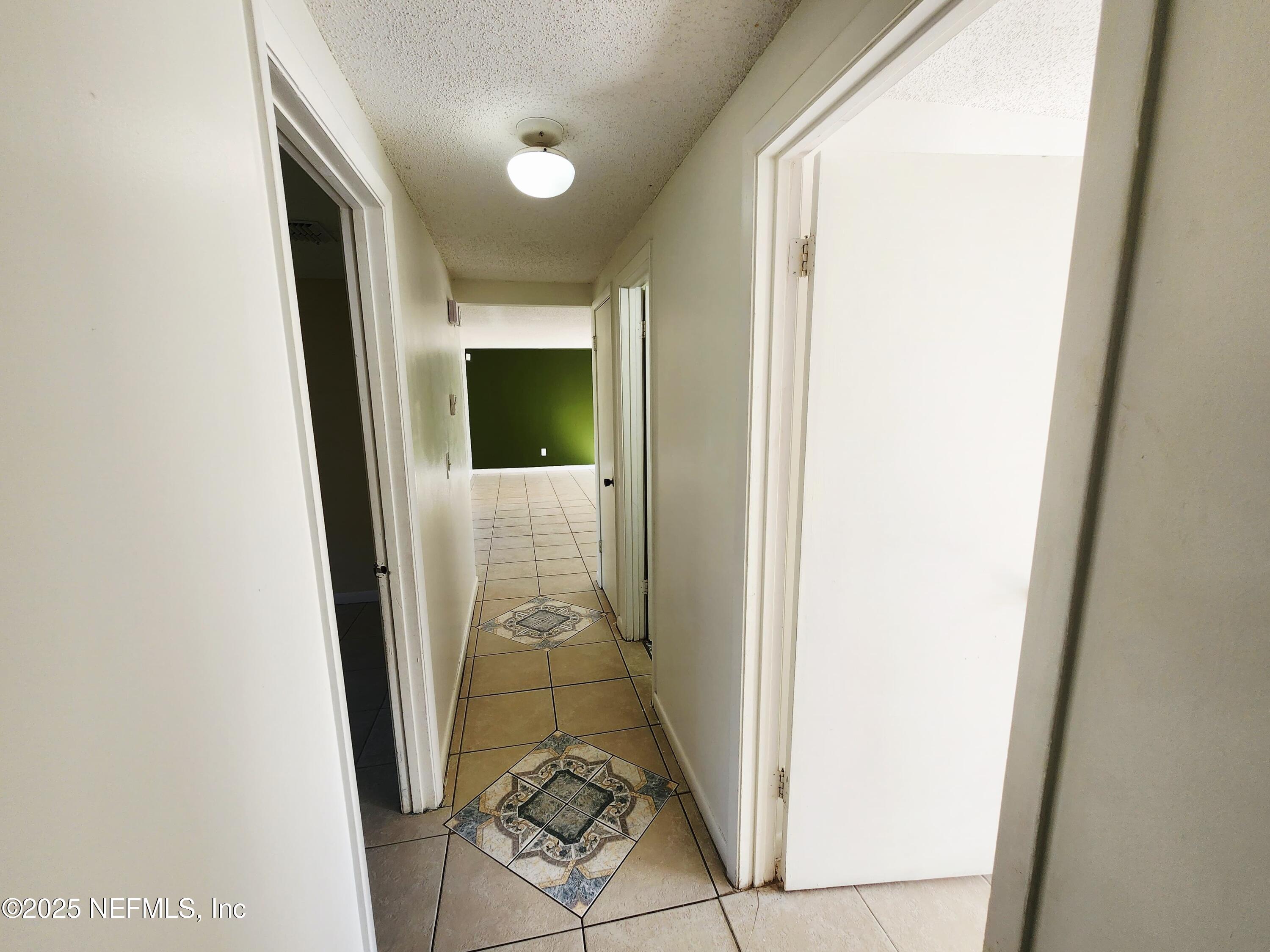 7127 Prellie Street Jacksonville, FL 32210 - Photo 16 of 16 view of a hallway