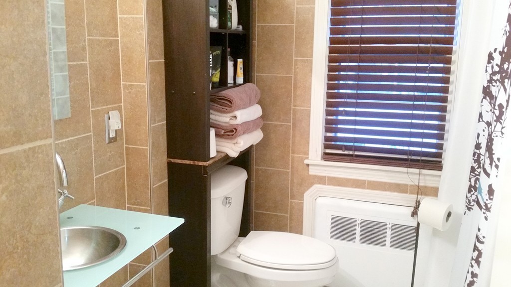 237 Draper Street Springfield, MA 01108 - Photo 13 of 30 a bathroom with a sink a toilet and shower