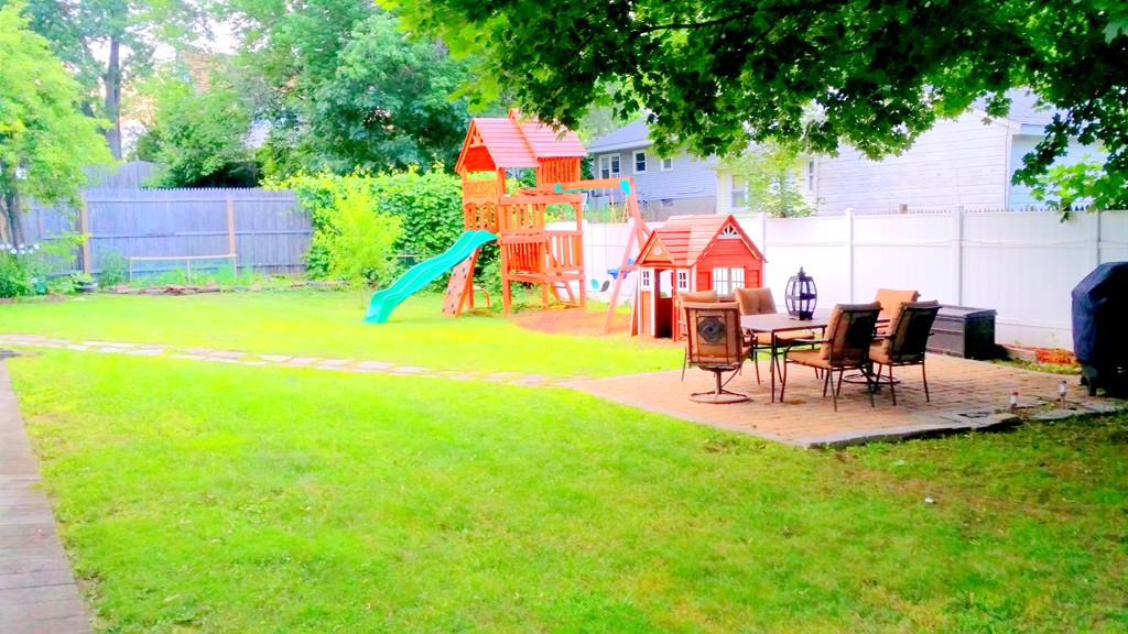 237 Draper Street Springfield, MA 01108 - Photo 3 of 30 a view of back yard of the house and outdoor seating