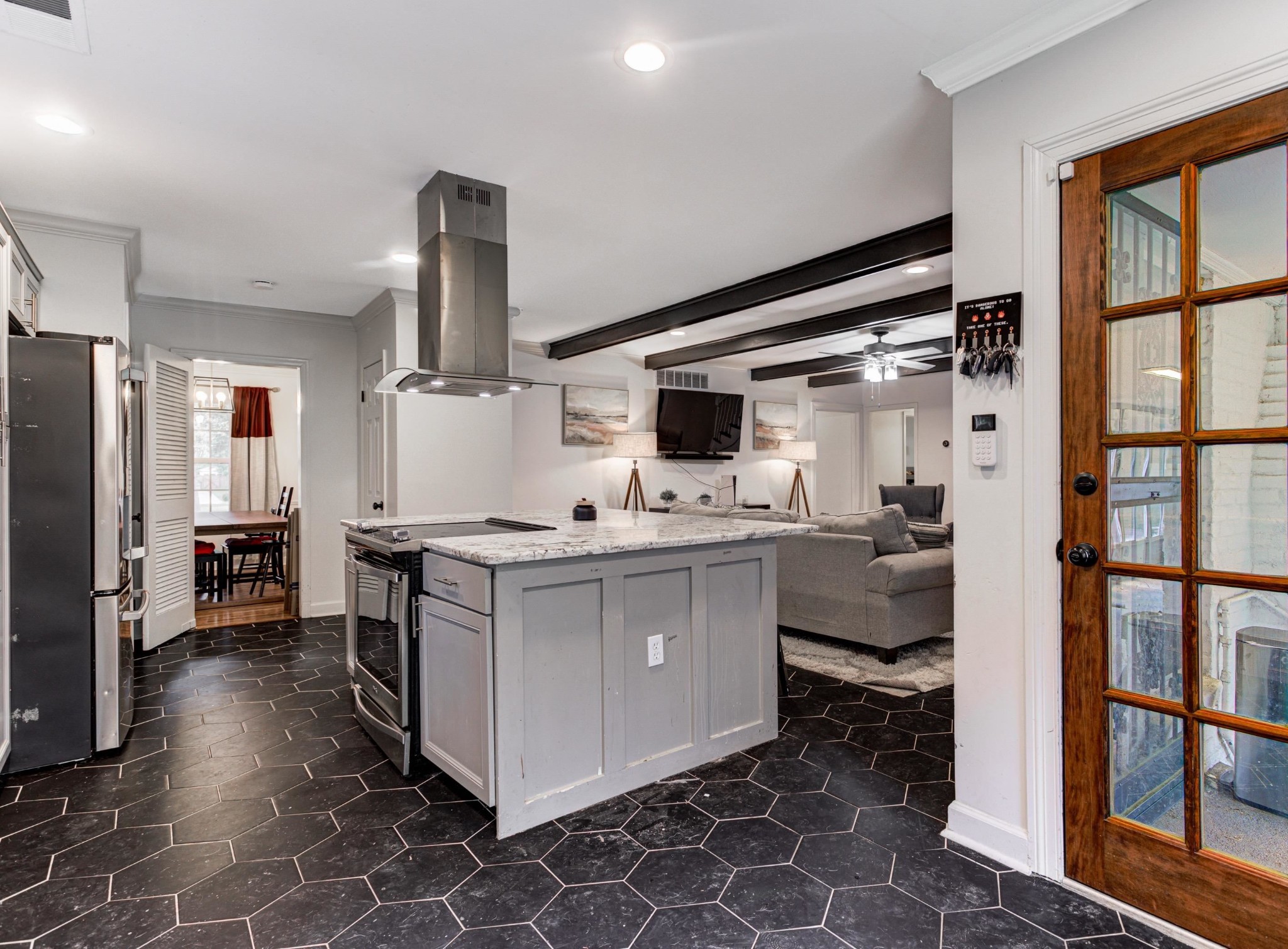 8929 Rocky Point Road Cordova, TN 38018 - Photo 12 of 37 a kitchen with sink refrigerator and cabinets