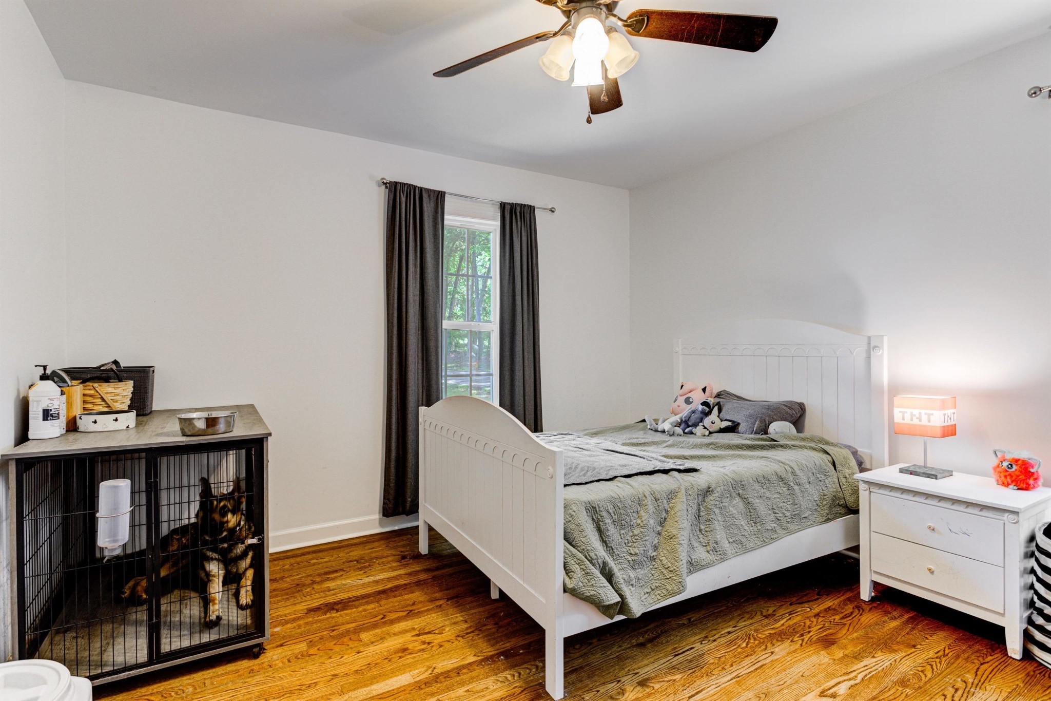 8929 Rocky Point Road Cordova, TN 38018 - Photo 16 of 37 a bedroom with a bed and a chandelier