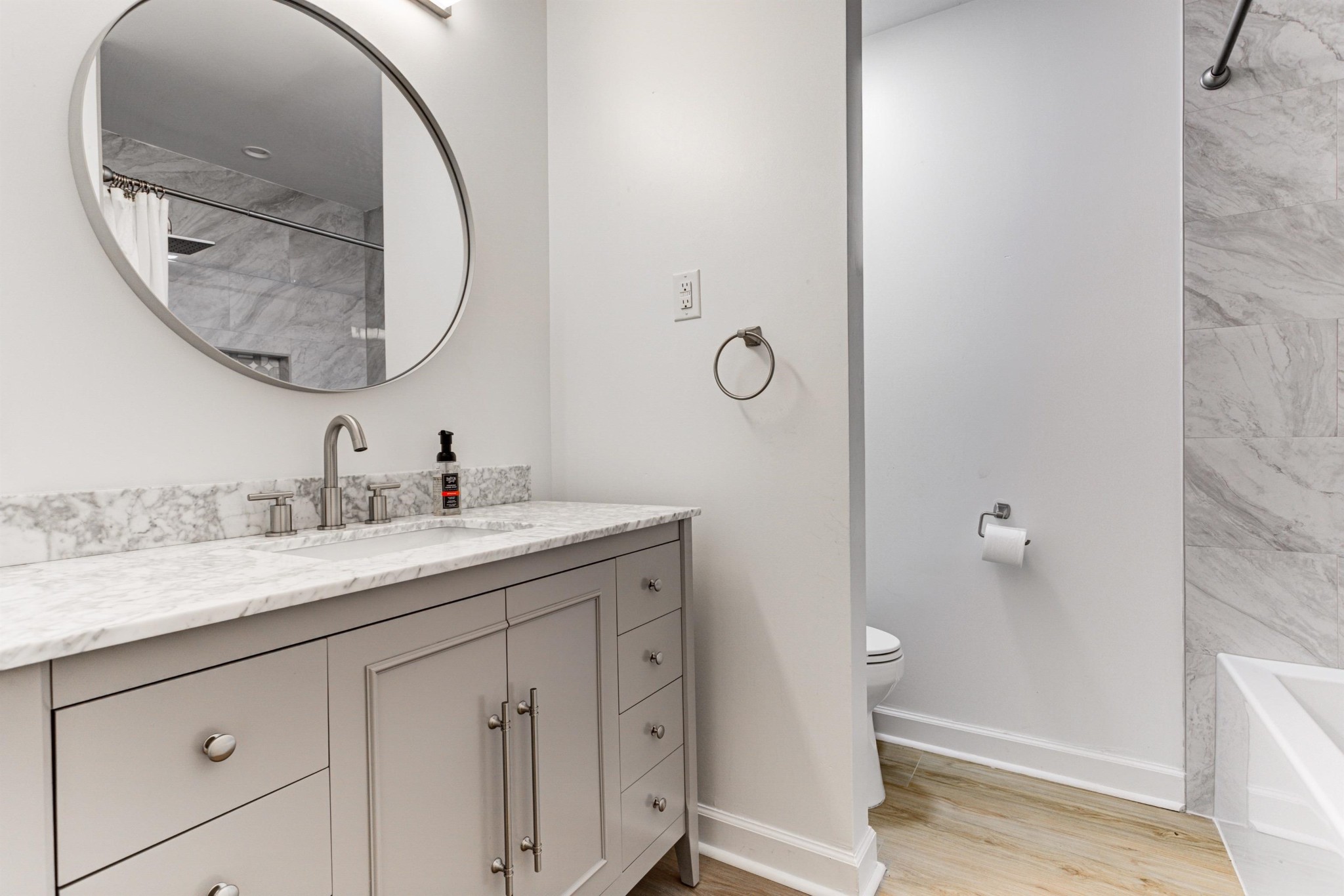 8929 Rocky Point Road Cordova, TN 38018 - Photo 17 of 37 a bathroom with a granite countertop sink and a mirror