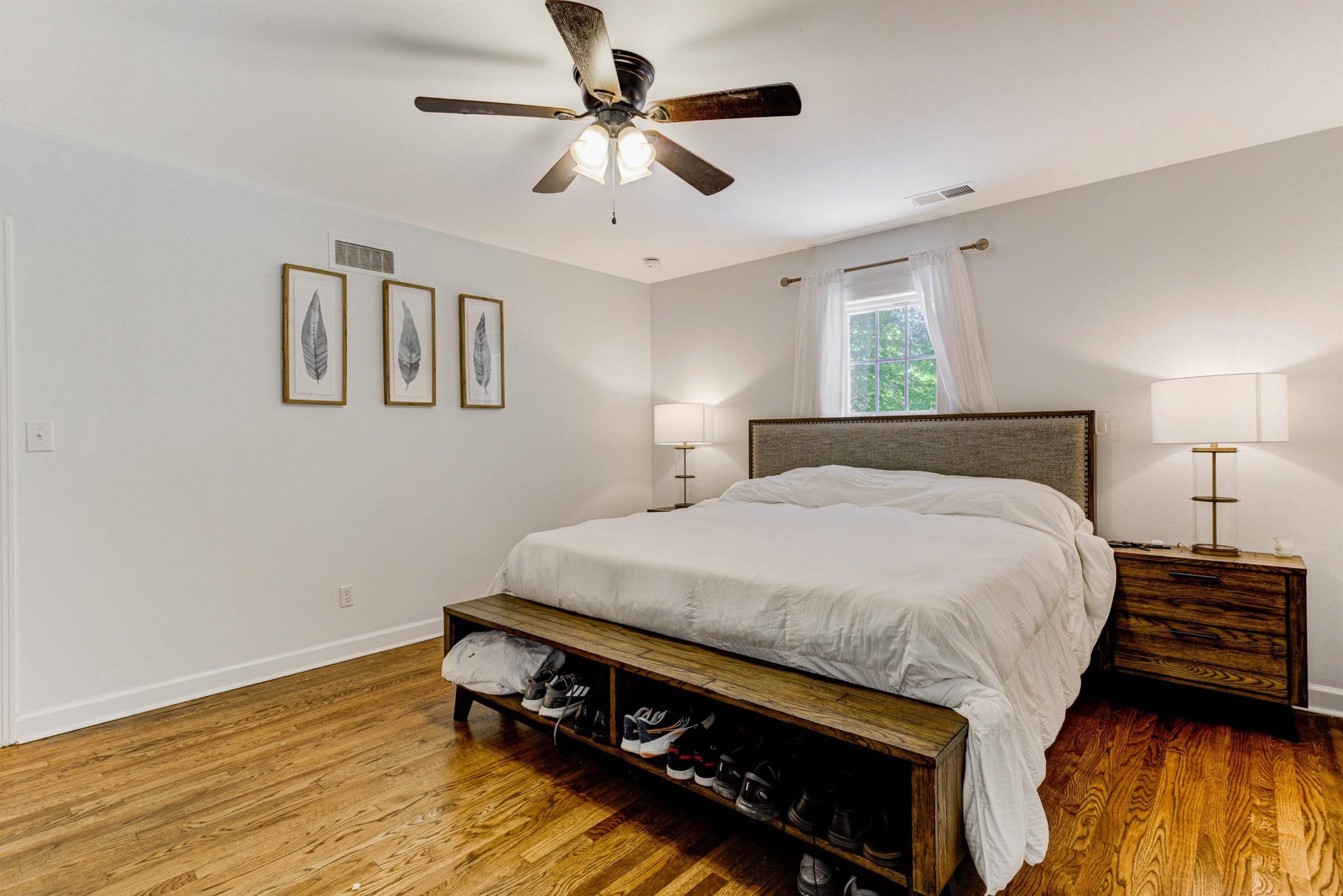8929 Rocky Point Road Cordova, TN 38018 - Photo 19 of 37 a bedroom with a bed and a ceiling fan