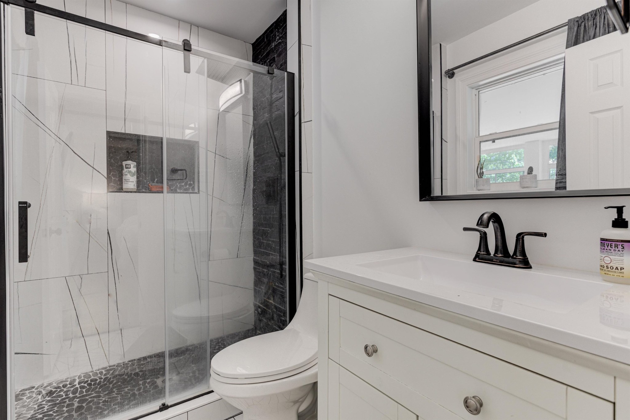 8929 Rocky Point Road Cordova, TN 38018 - Photo 21 of 37 a bathroom with a sink a toilet and shower
