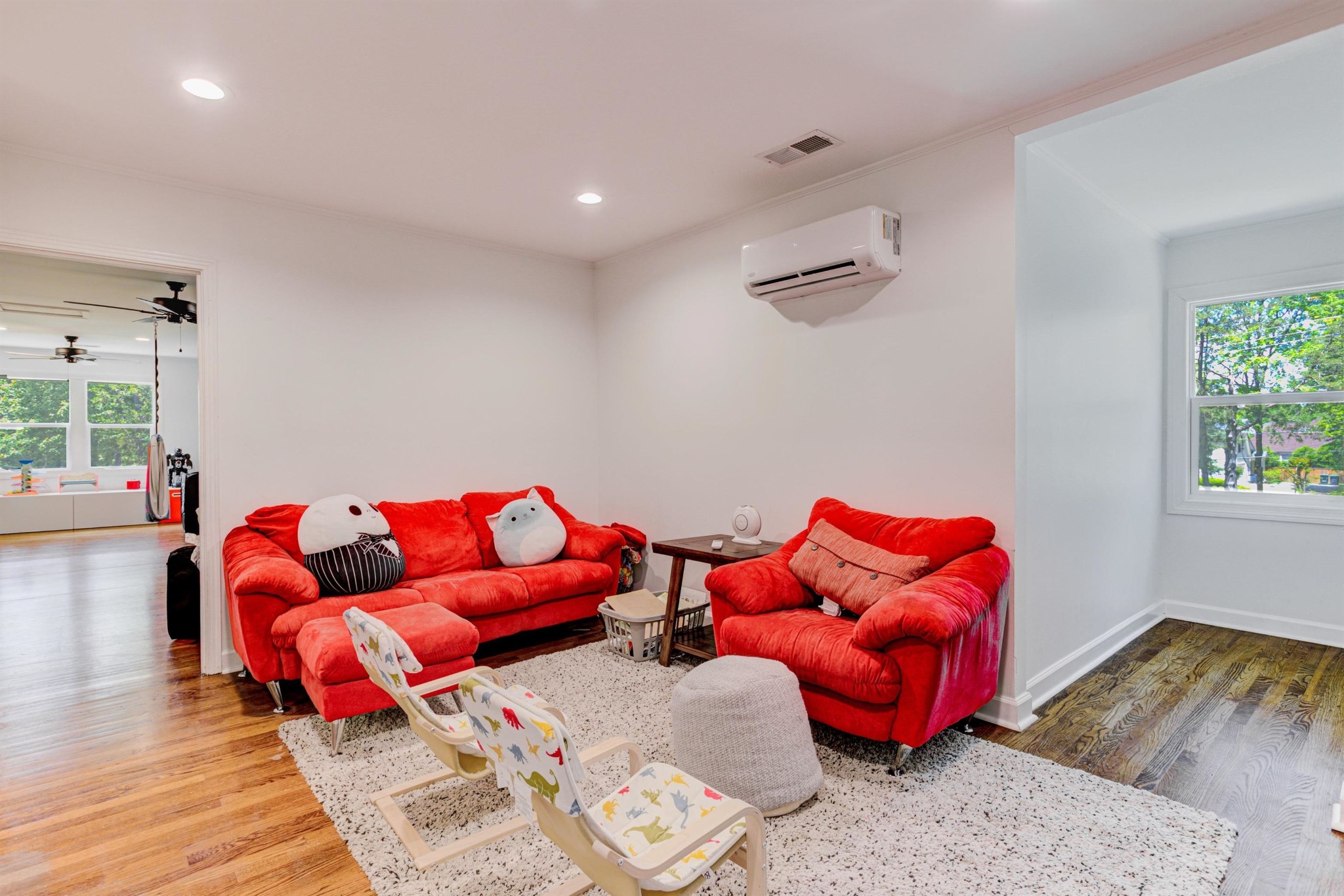 8929 Rocky Point Road Cordova, TN 38018 - Photo 23 of 37 a living room with furniture and a wooden floor