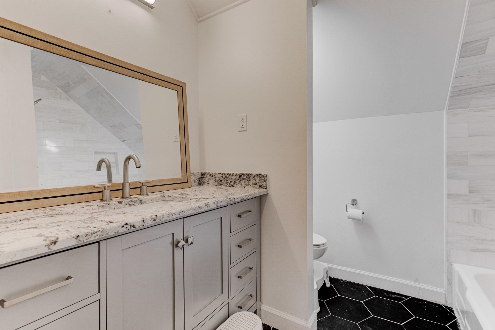 8929 Rocky Point Road Cordova, TN 38018 - Photo 25 of 37 a bathroom with a granite countertop sink and a mirror
