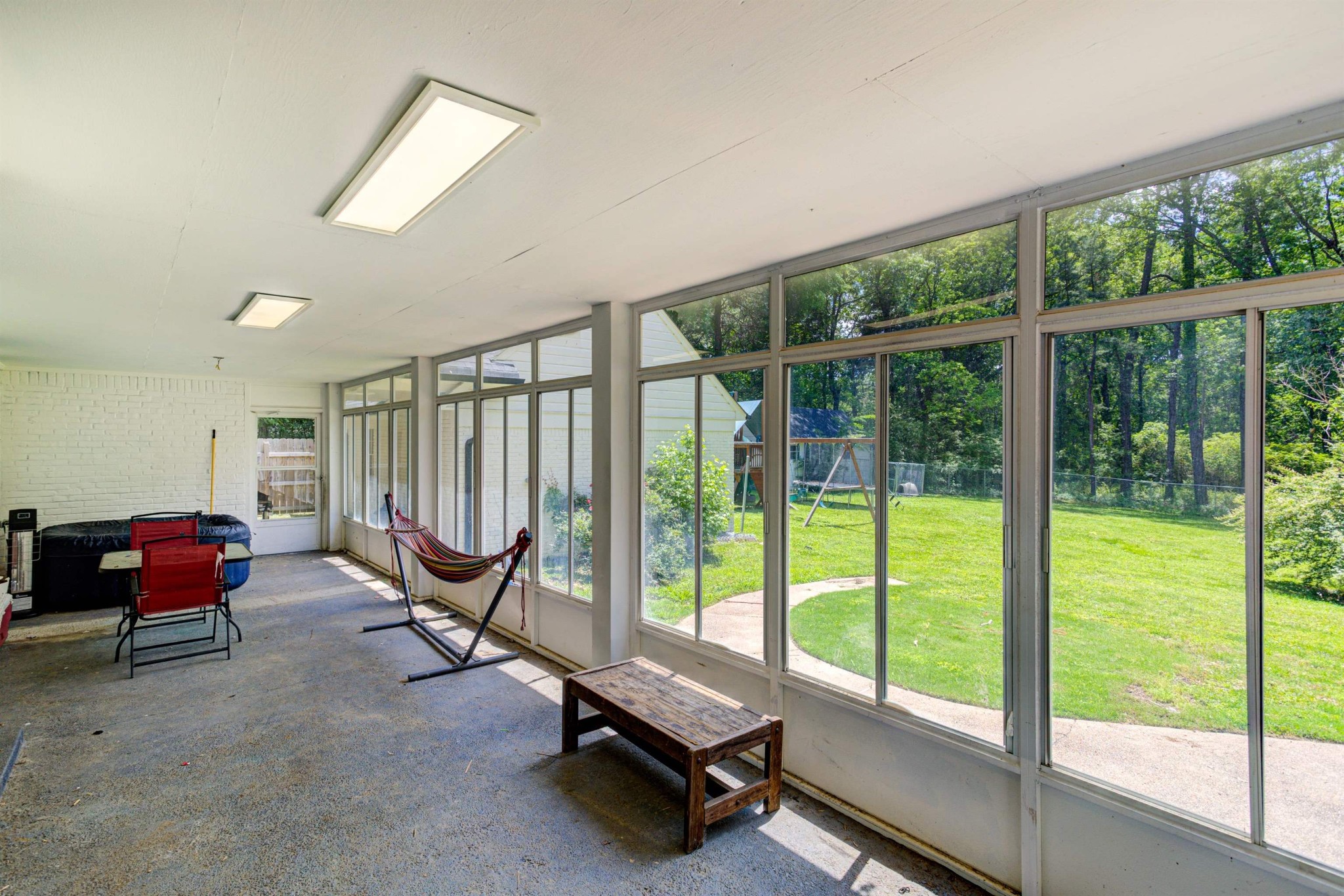 8929 Rocky Point Road Cordova, TN 38018 - Photo 29 of 37 a view of a room with gym equipment and floor to ceiling window