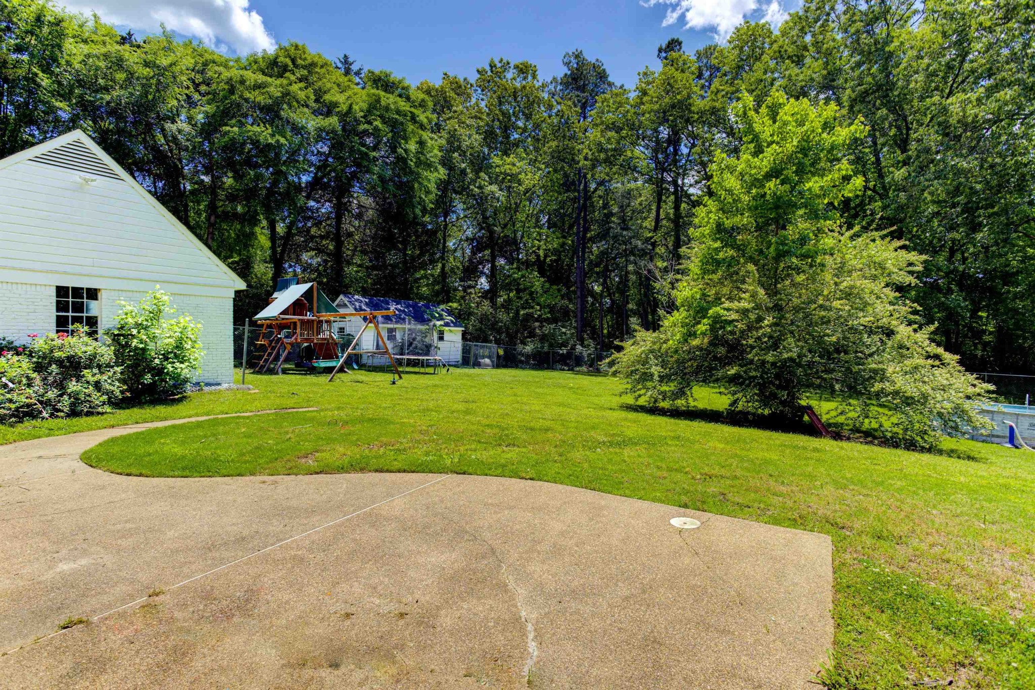 8929 Rocky Point Road Cordova, TN 38018 - Photo 30 of 37 a view of a house with a big yard plants and large trees