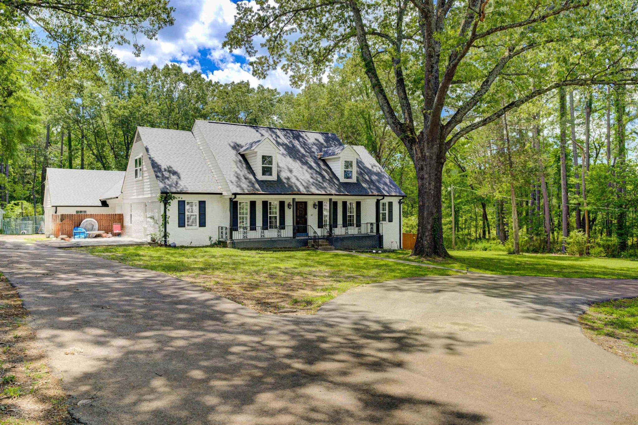 8929 Rocky Point Road Cordova, TN 38018 - Photo 37 of 37 a view of a yard in front of a house with large trees