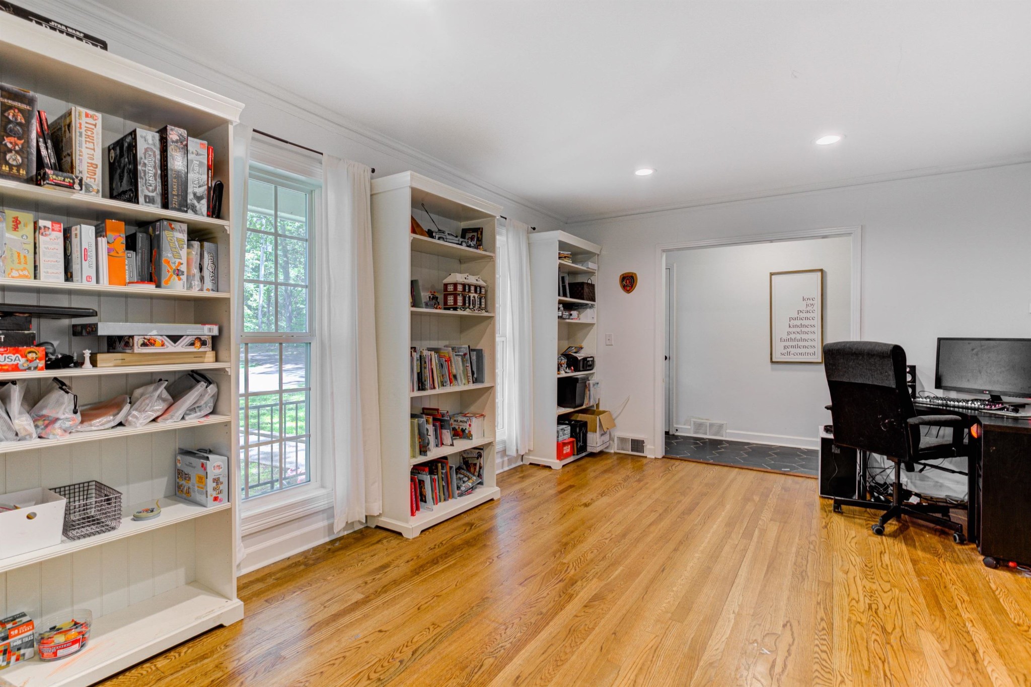 8929 Rocky Point Road Cordova, TN 38018 - Photo 5 of 37 a room with a bed and a book shelf