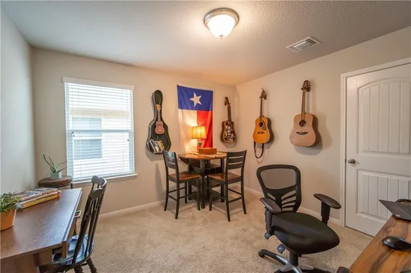 a view of a livingroom with furniture and a window