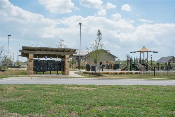 a view of a swimming pool and a yard