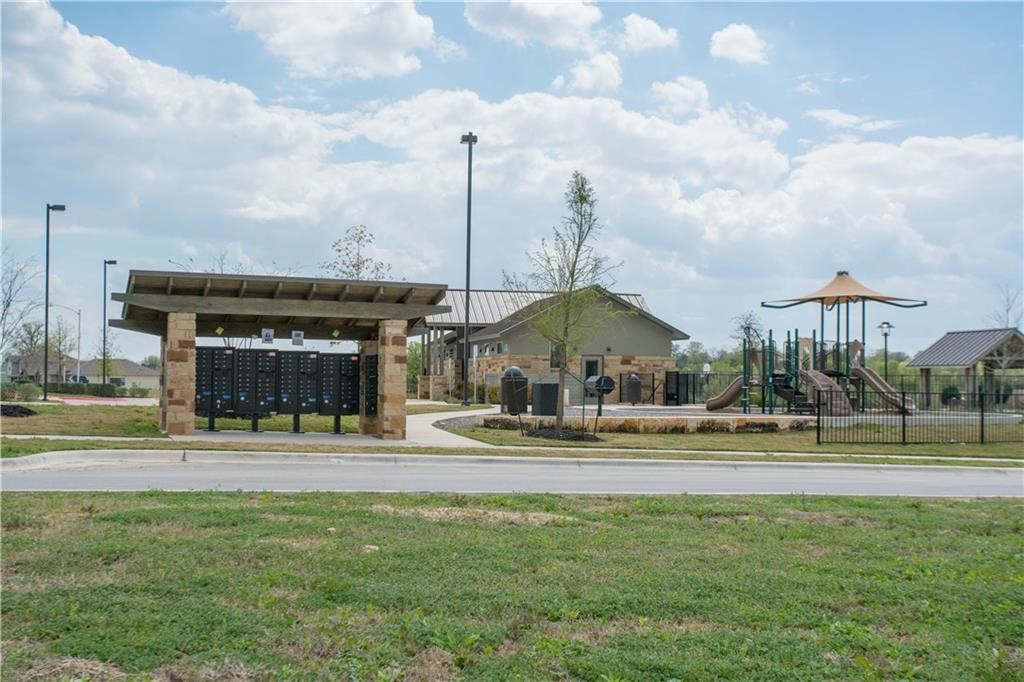 10406 Hatton Lane Austin, TX 78754 - Photo 19 of 22 a view of a swimming pool and a yard