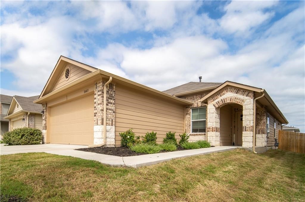 10406 Hatton Lane Austin, TX 78754 - Photo 2 of 22 a front view of a house with a garden and entryway