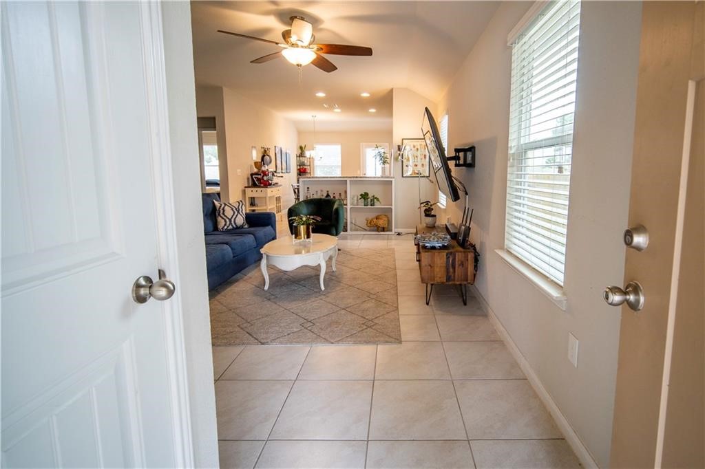 10406 Hatton Lane Austin, TX 78754 - Photo 4 of 22 a very nice looking room with a large window and chandelier