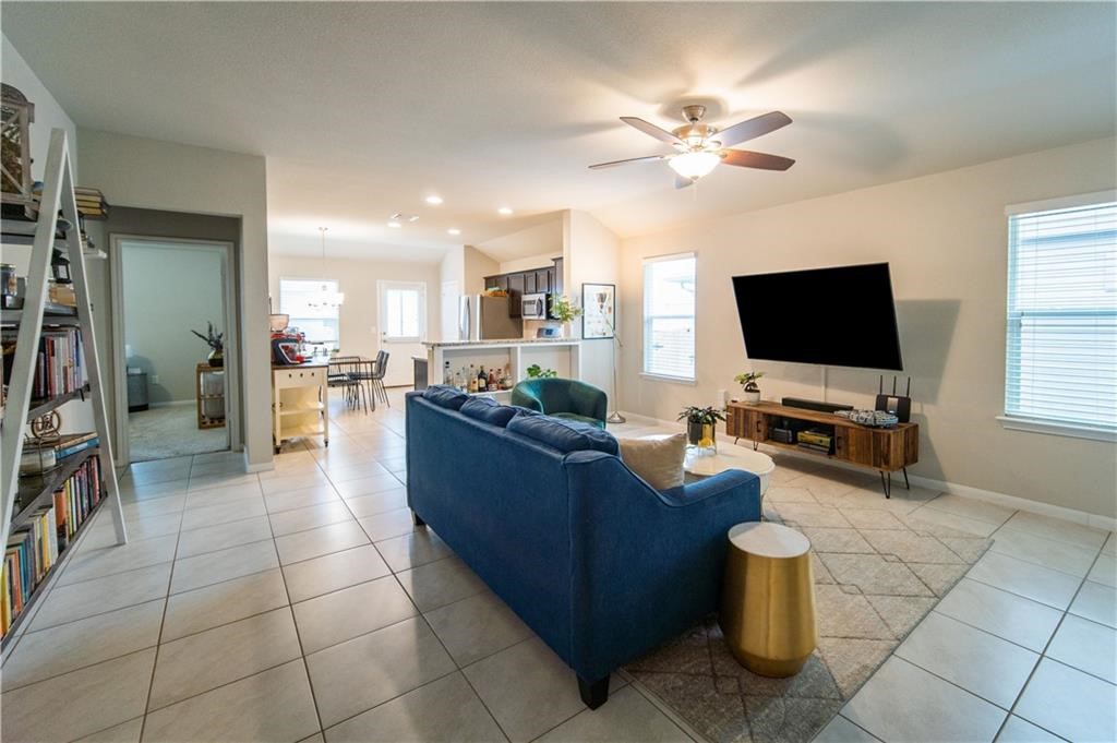 10406 Hatton Lane Austin, TX 78754 - Photo 7 of 22 a living room with furniture and a flat screen tv