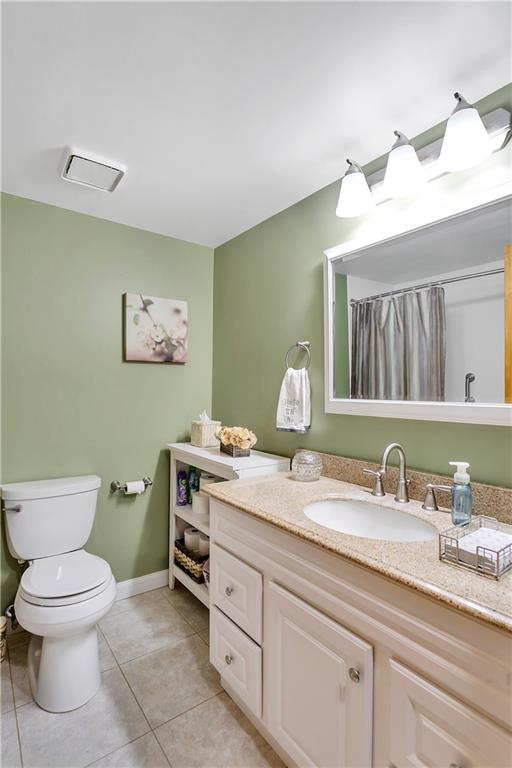 227 Brewer Road Freedom, PA 15042 - Photo 14 of 34 a spacious bathroom with a granite countertop sink mirror and toilet