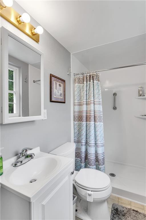 227 Brewer Road Freedom, PA 15042 - Photo 17 of 34 a bathroom with a sink toilet and shower