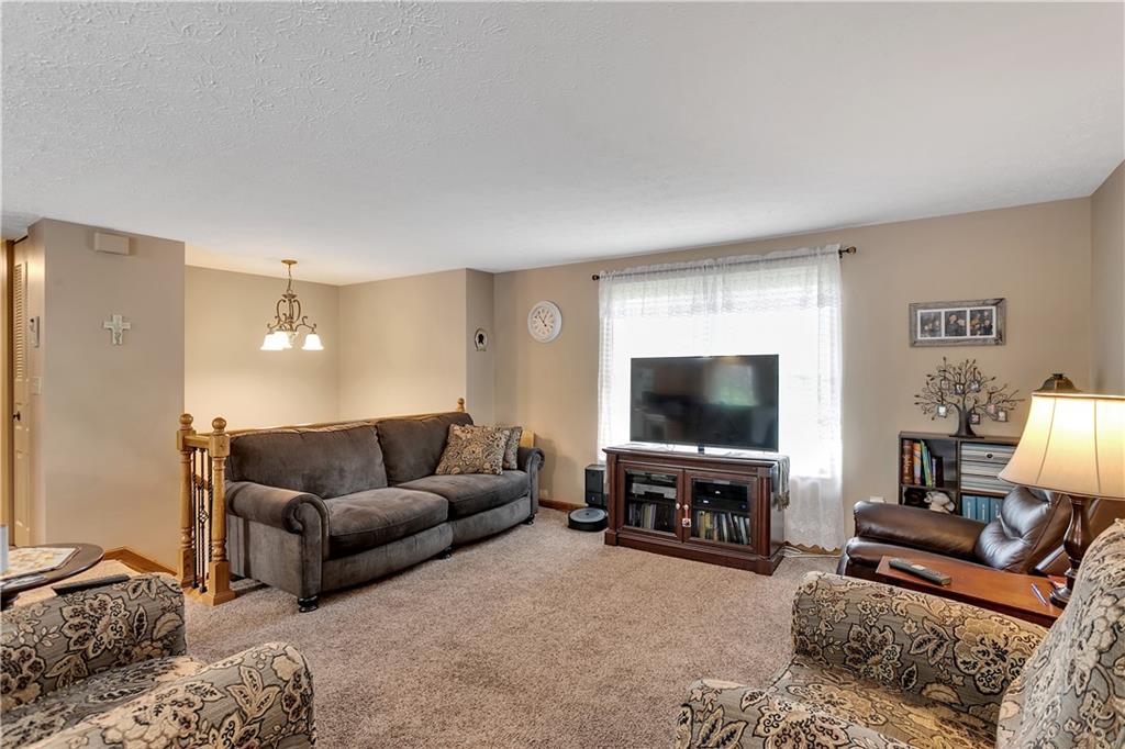 227 Brewer Road Freedom, PA 15042 - Photo 5 of 34 a living room with furniture and a flat screen tv