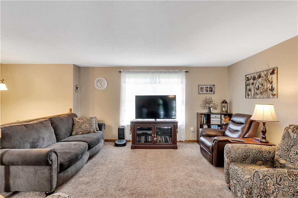 227 Brewer Road Freedom, PA 15042 - Photo 6 of 34 a living room with furniture and a flat screen tv