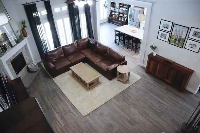 a view of a workspace with furniture and natural light