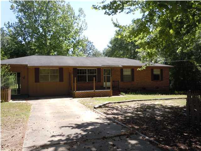 665 Ridge Lake Road Crestview, FL 32536 - Photo 1 of 14 a front view of a house with a yard