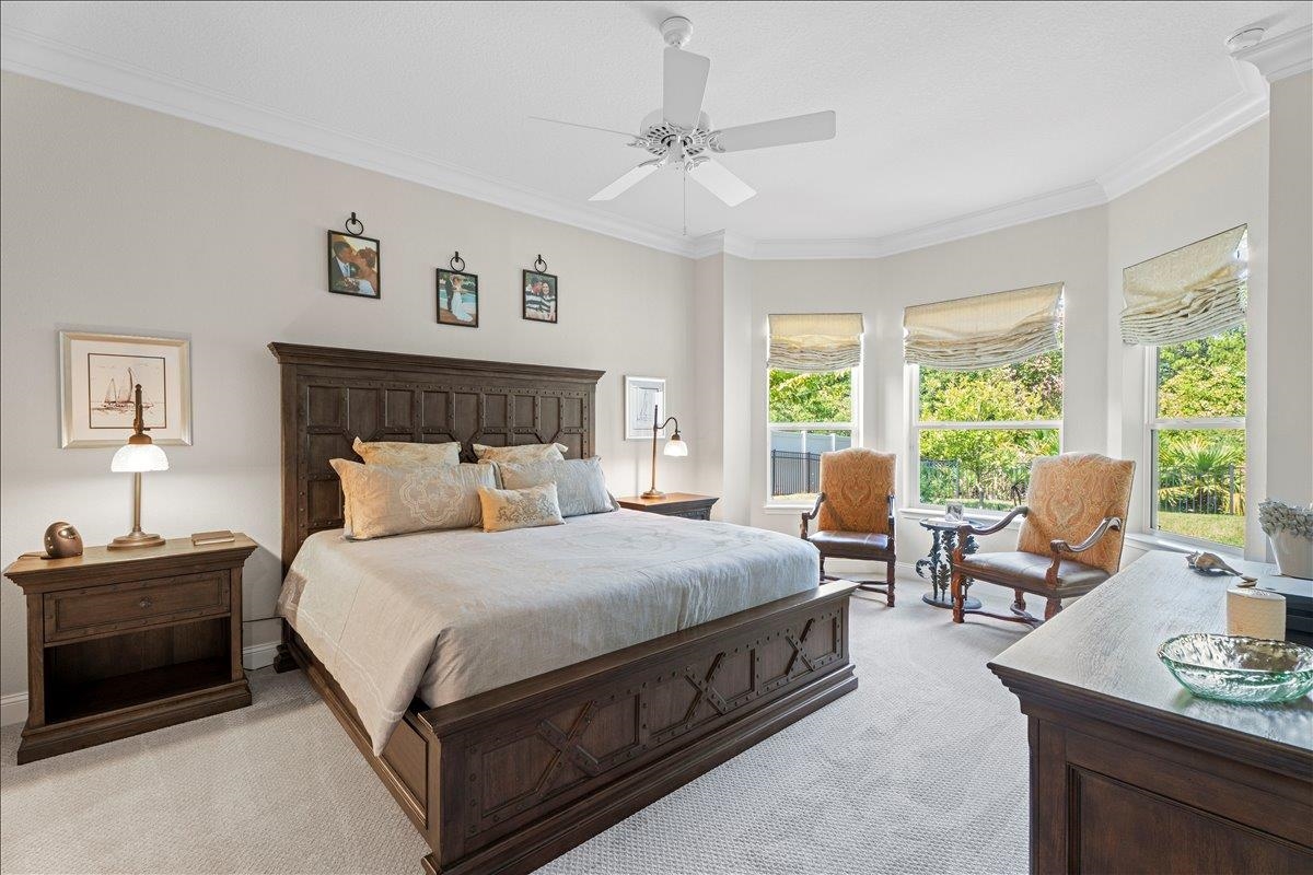 145 Paranza Trace St. Augustine, FL 32095 - Photo 11 of 34 a bedroom with a bed gym equipment and a window