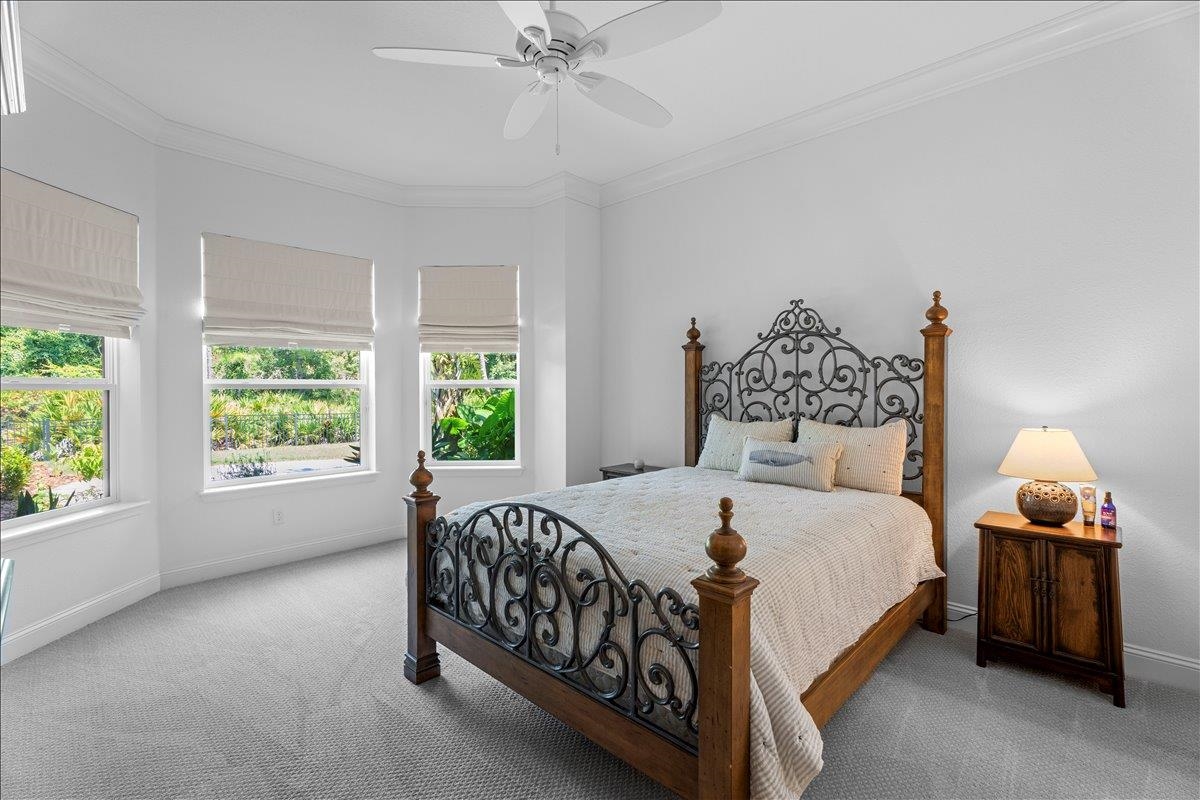 145 Paranza Trace St. Augustine, FL 32095 - Photo 13 of 34 a bedroom with a bed and large window