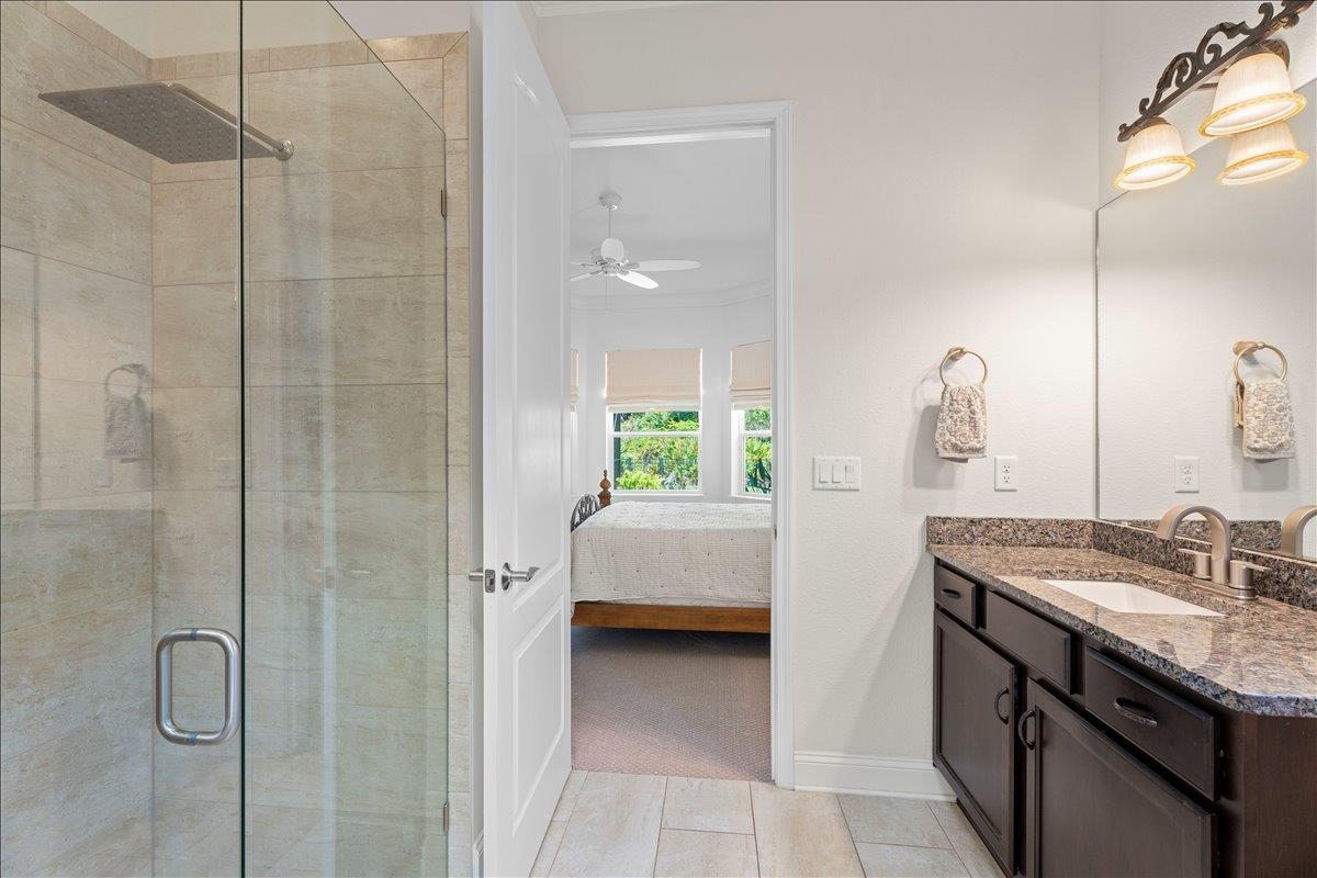 145 Paranza Trace St. Augustine, FL 32095 - Photo 14 of 34 a en suite bathroom with a granite countertop sink a toilet and shower