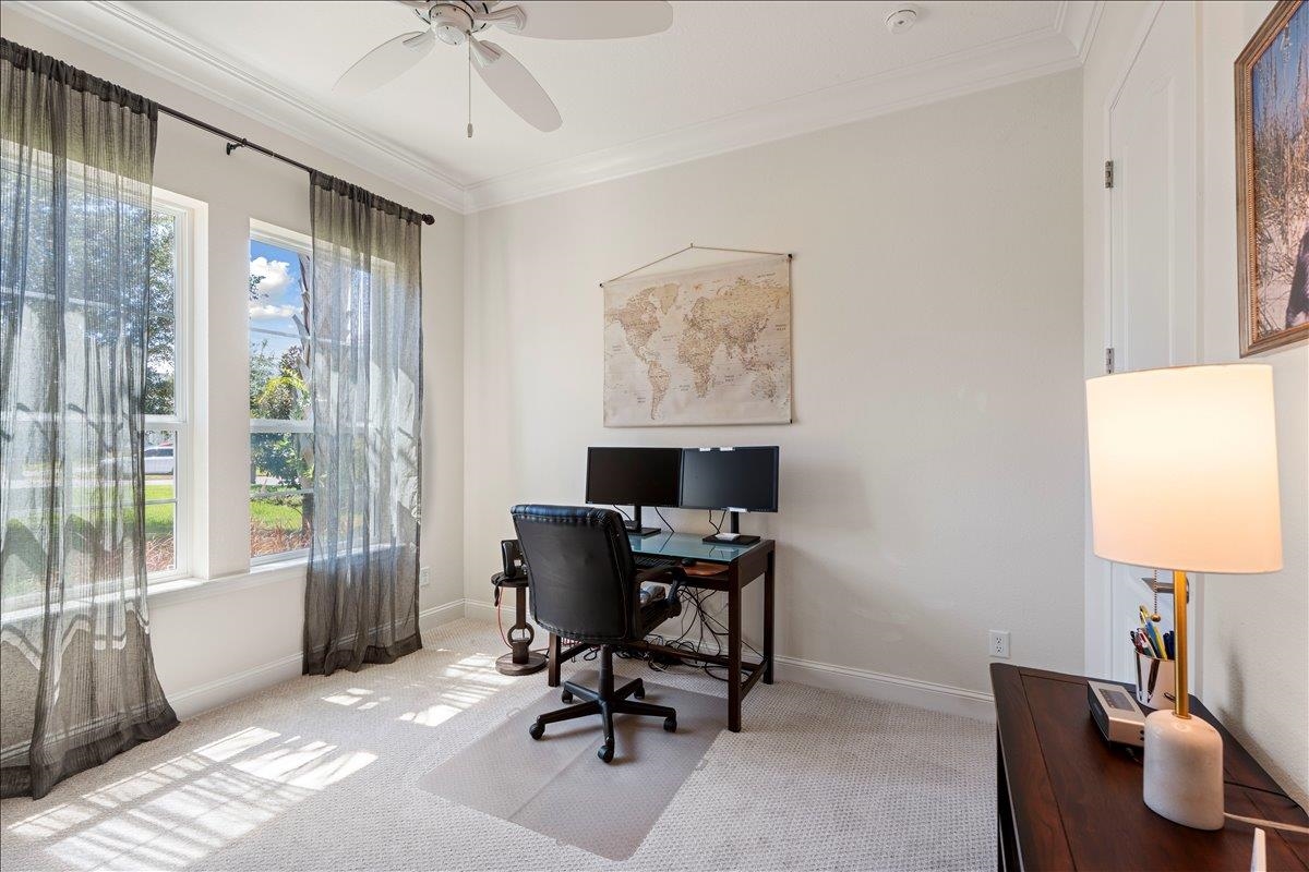 145 Paranza Trace St. Augustine, FL 32095 - Photo 16 of 34 a view of a workspace with furniture and a window