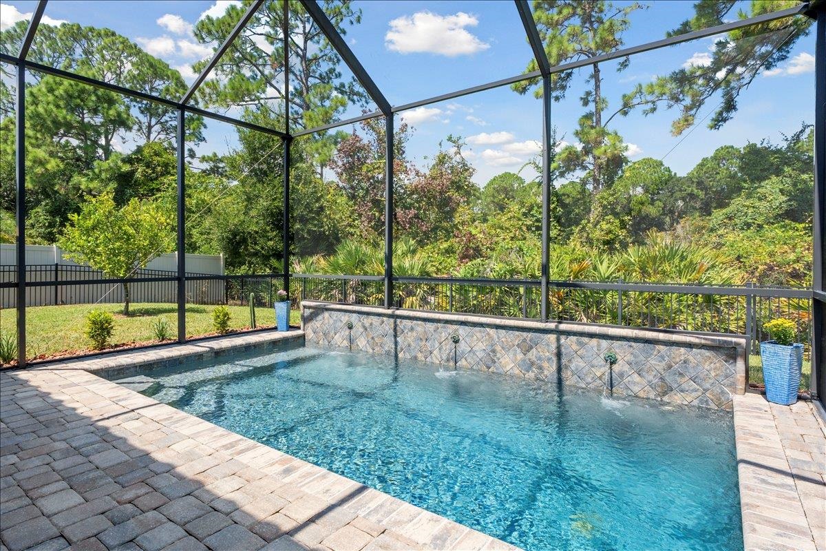 145 Paranza Trace St. Augustine, FL 32095 - Photo 21 of 34 a view of swimming pool with a back yard