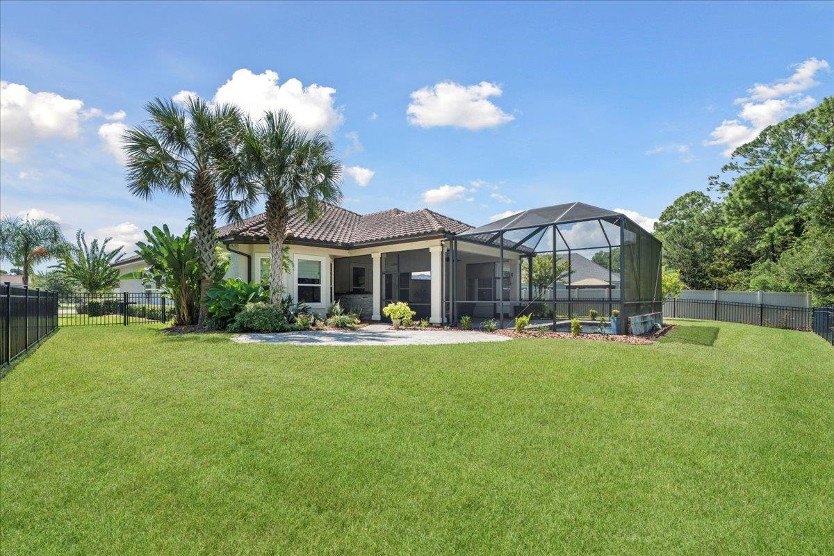 145 Paranza Trace St. Augustine, FL 32095 - Photo 24 of 34 a front view of house with yard and outdoor seating