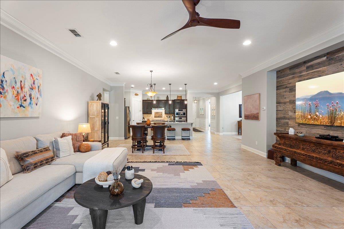 145 Paranza Trace St. Augustine, FL 32095 - Photo 6 of 34 a living room with furniture and a flat screen tv