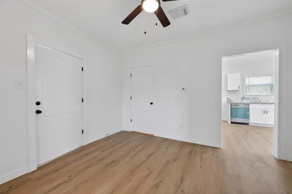 a view of a kitchen with wooden floor
