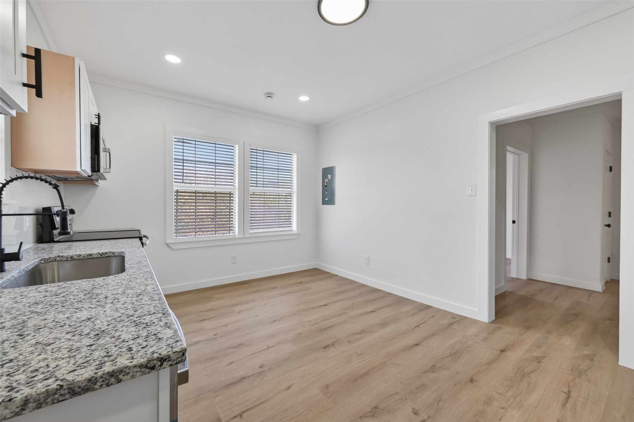 2202 Hutchins Street, Unit D Houston, TX 77003 - Photo 14 of 33 a bathroom with a granite countertop sink and mirror