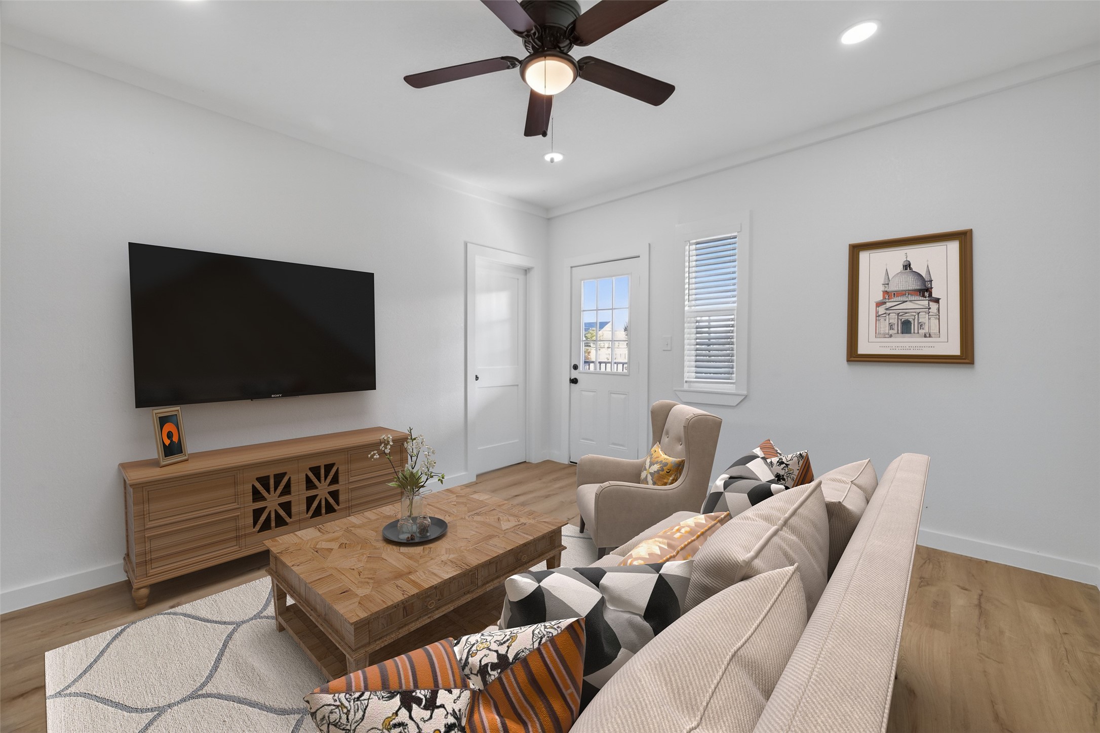 2202 Hutchins Street, Unit D Houston, TX 77003 - Photo 17 of 39 a living room with furniture and a flat screen tv