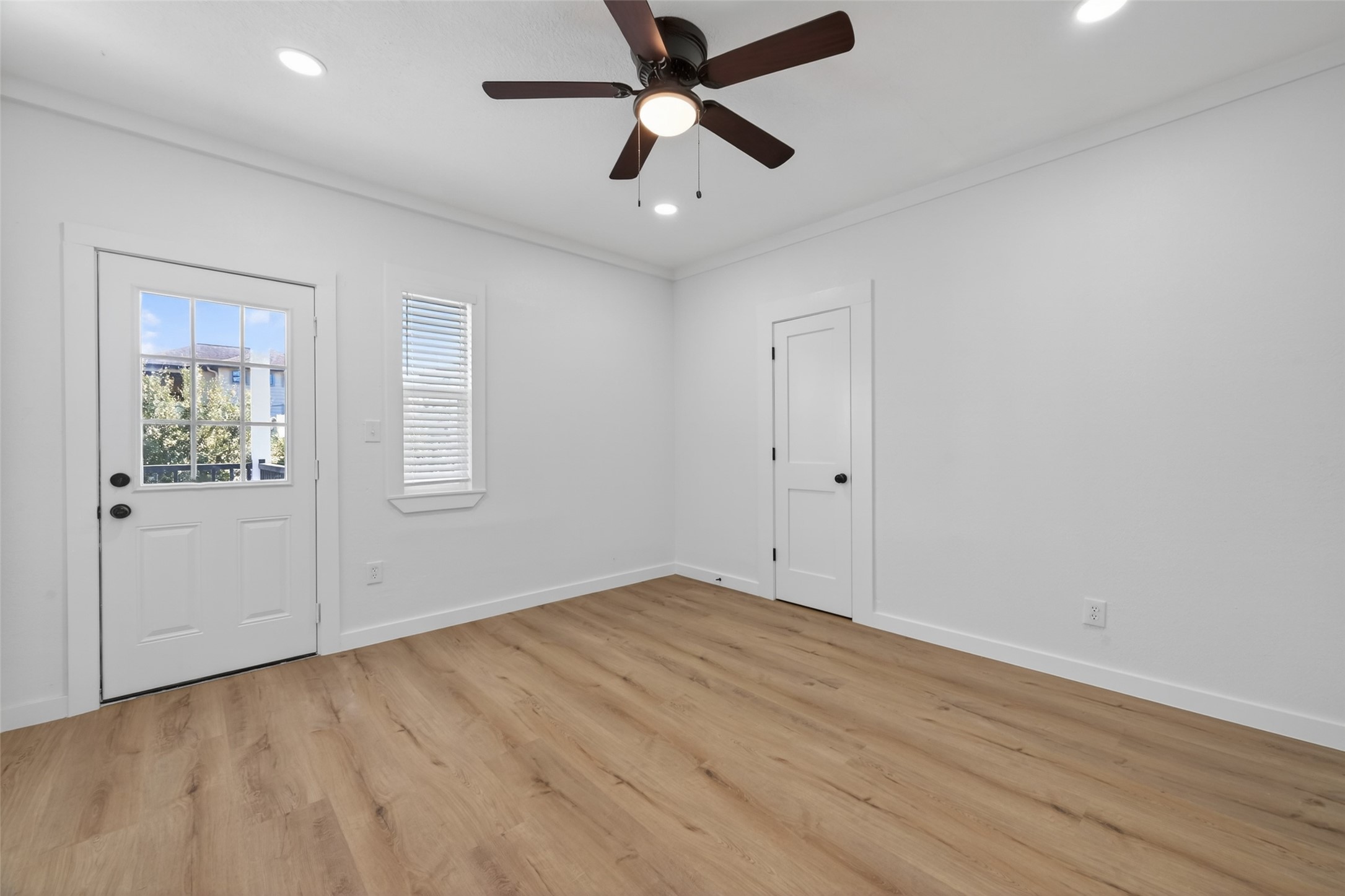 2202 Hutchins Street, Unit D Houston, TX 77003 - Photo 18 of 33 wooden floor in an empty room with a window