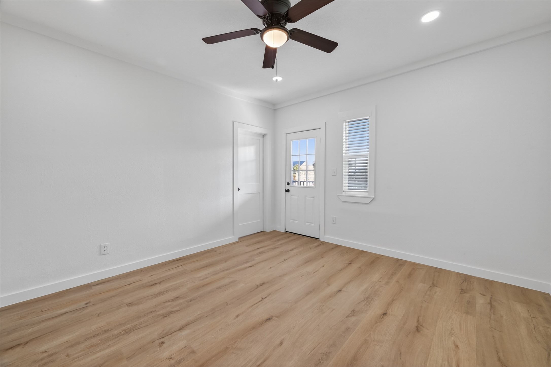 2202 Hutchins Street, Unit D Houston, TX 77003 - Photo 18 of 39 wooden floor in an empty room with a window