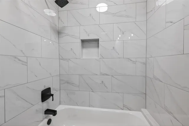 a view of a building with a small yard