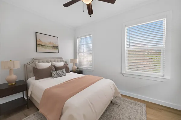 a bedroom with bed and window